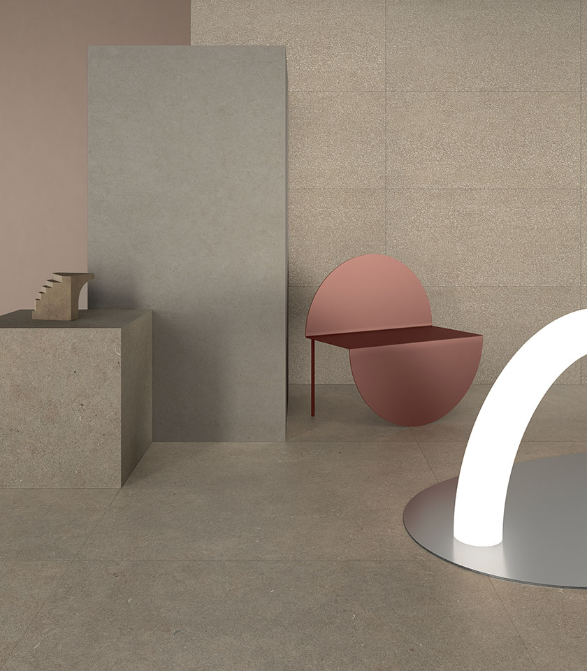 Minimalist interior with stone-effect surfaces, neutral tones and sculptural furnishings for a contemporary, essential space.