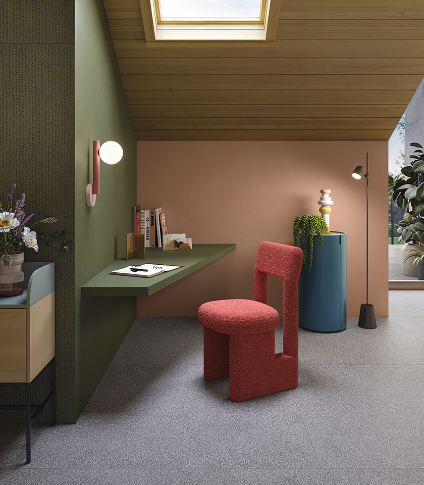 Contemporary study corner with textured surfaces, warm colours and original designer furniture.