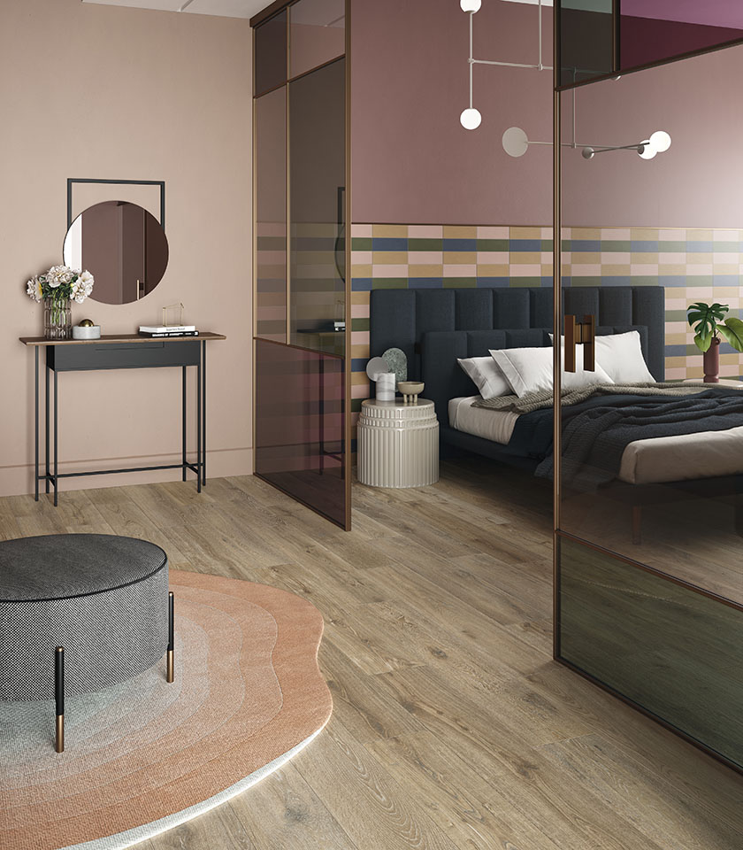 Bio Attitude Barrel brings the warmth of wood-effect ceramics into the bedroom, paired with the delicate tones of Pigmenti for a welcoming and contemporary interior.