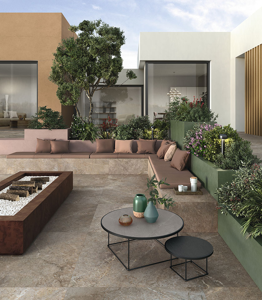 Contemporary outdoor space with flooring from the Anthology collection in Earth stone effect and elements from the Pigmenti collection in Moss, Mauve and Harvest shades.