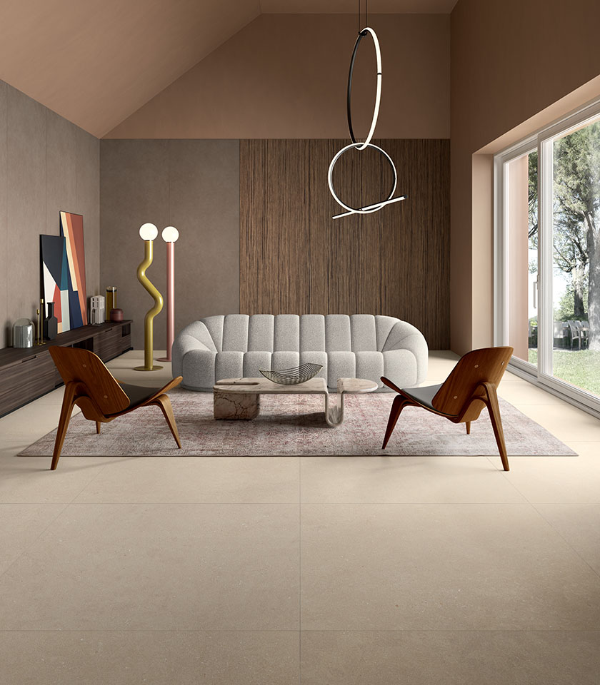 Contemporary living room with flooring from the Intense collection in Beige stone effect and wall coverings from the Pigmenti collection in the Pumice shade.