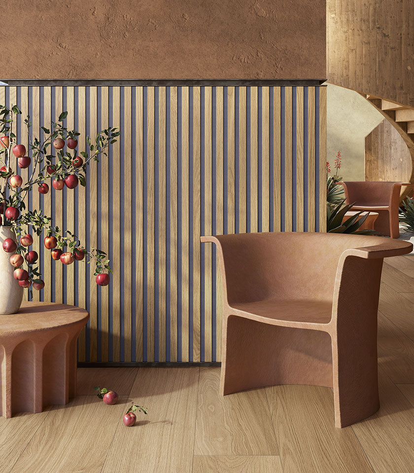 Japandi-style interior with wood-effect flooring and wall cladding, sculptural armchair and nature-inspired decorative details.
