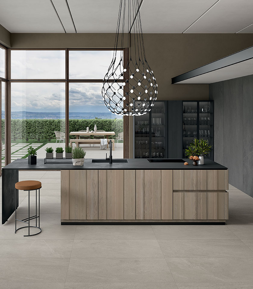 Contemporary kitchen featuring Nextone surfaces by Lea Ceramiche: stone-effect porcelain stoneware for elegant, functional and seamless interiors.